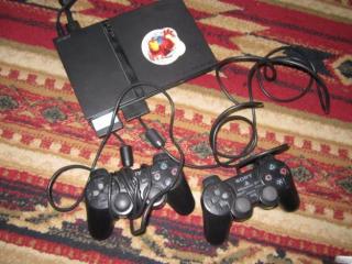 Playstation 2 (PAL) + 15 игр+Руль Logitech+Guitar Hero